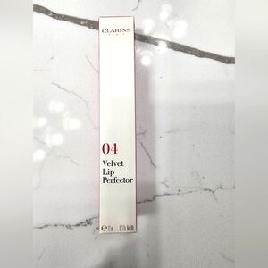 Clarins 04 velvet lip protector: velvet raspberry